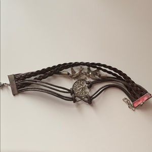 Leather bracelet with silver charms